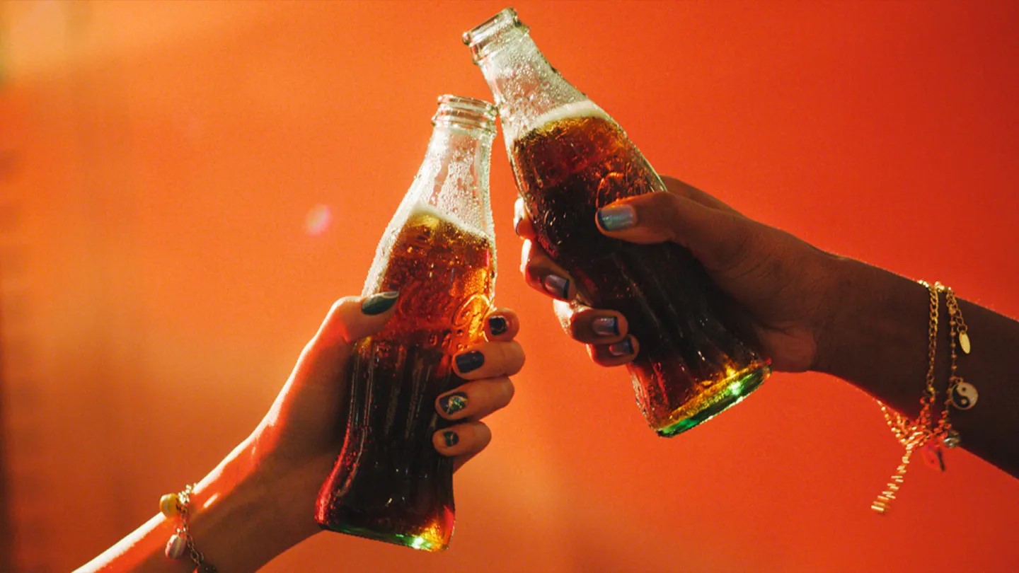 Coca-Cola bottles on red background