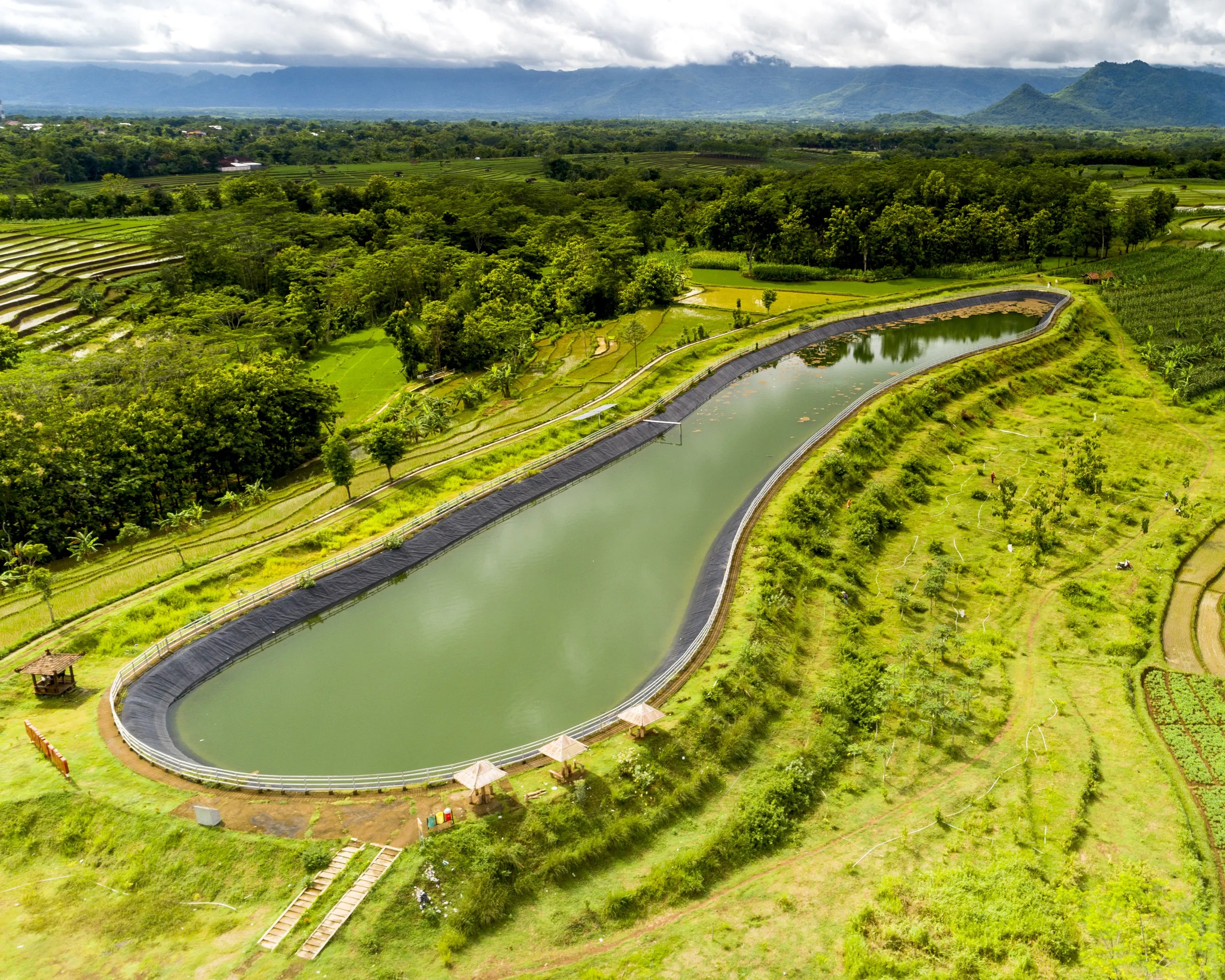 Aerial view of a dam in a rural area