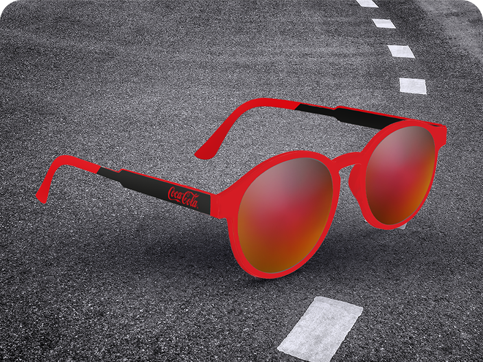 A pair of red-framed retro sunglasses with the Coca-Cola logo, a stylish prize from the Road Trip contest collection.
