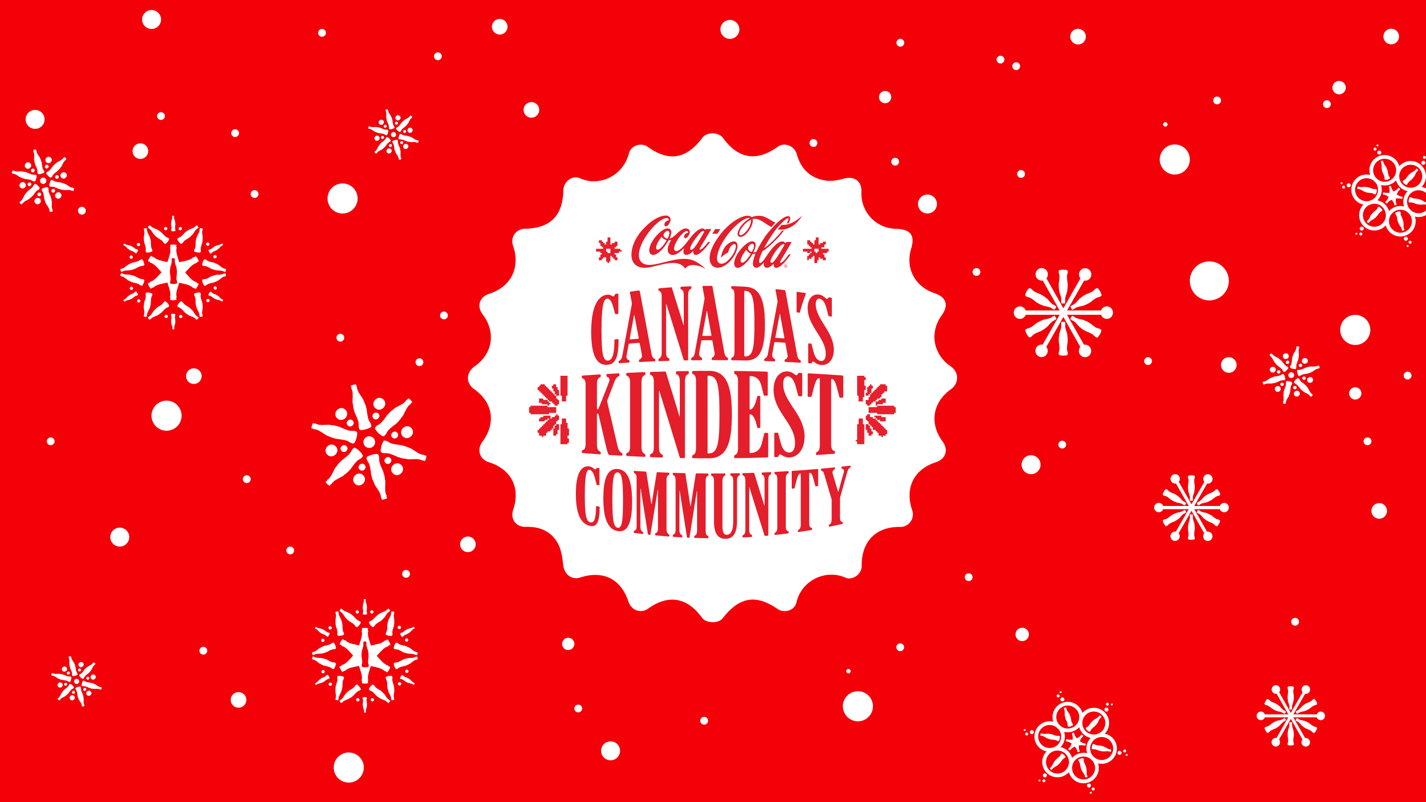 Canada's Kindest Community on a red back ground with white snowflakes