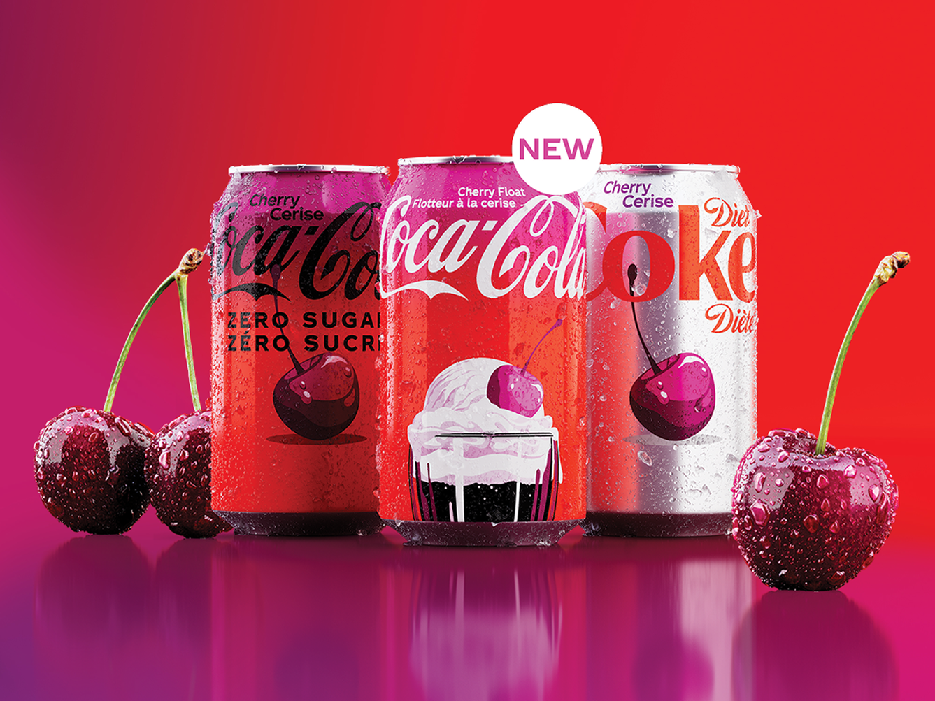 Cherry Coca-Cola, Cherry Float and Diet Coke Cherry cans with fresh cherries on a pink and red background