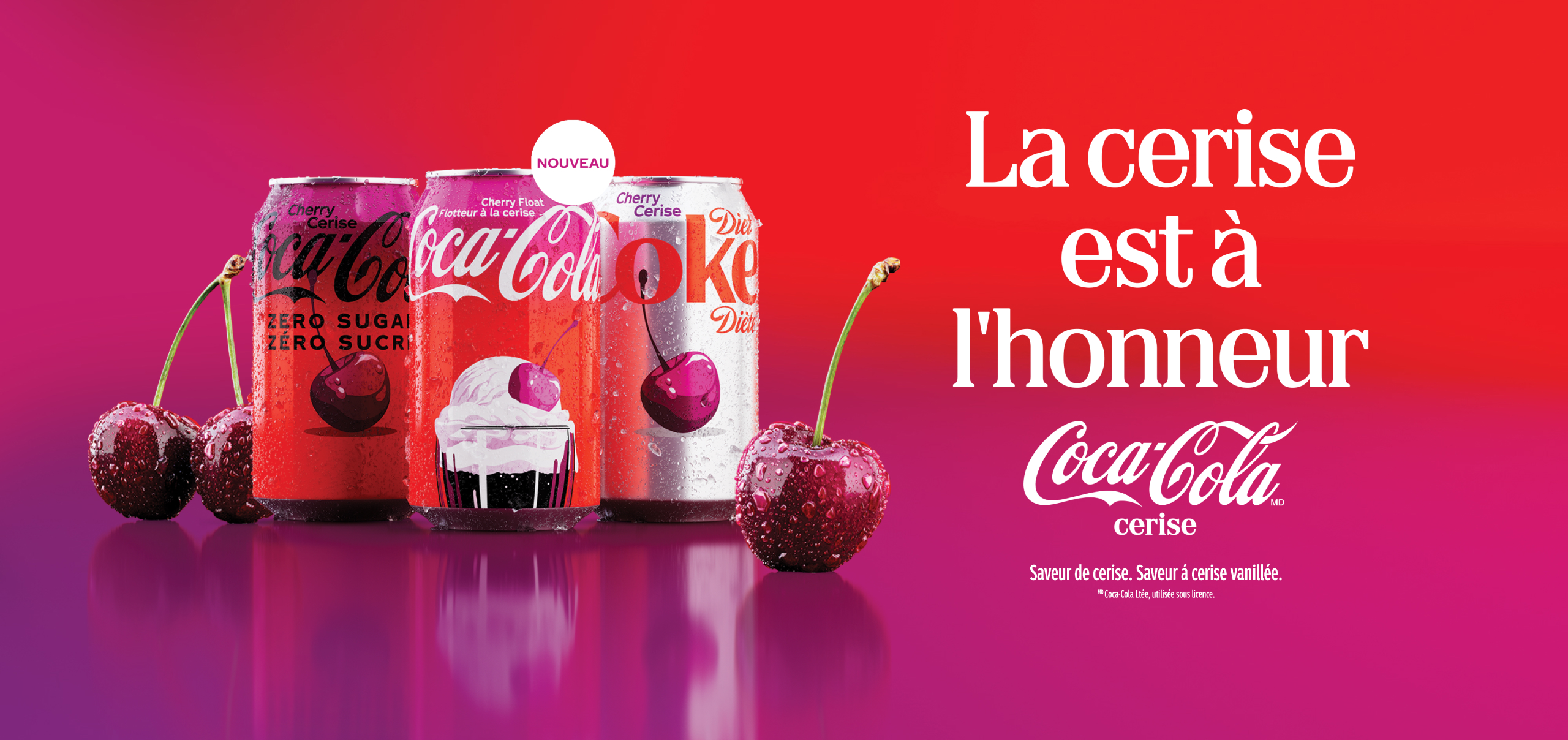 Three Coca-Cola Cherry cans — Cherry Zero Sugar, Cherry Float, and Diet Coke Cherry — with fresh cherries on a red-to-pink gradient background and text reading "La cerise est à l'honneur."
