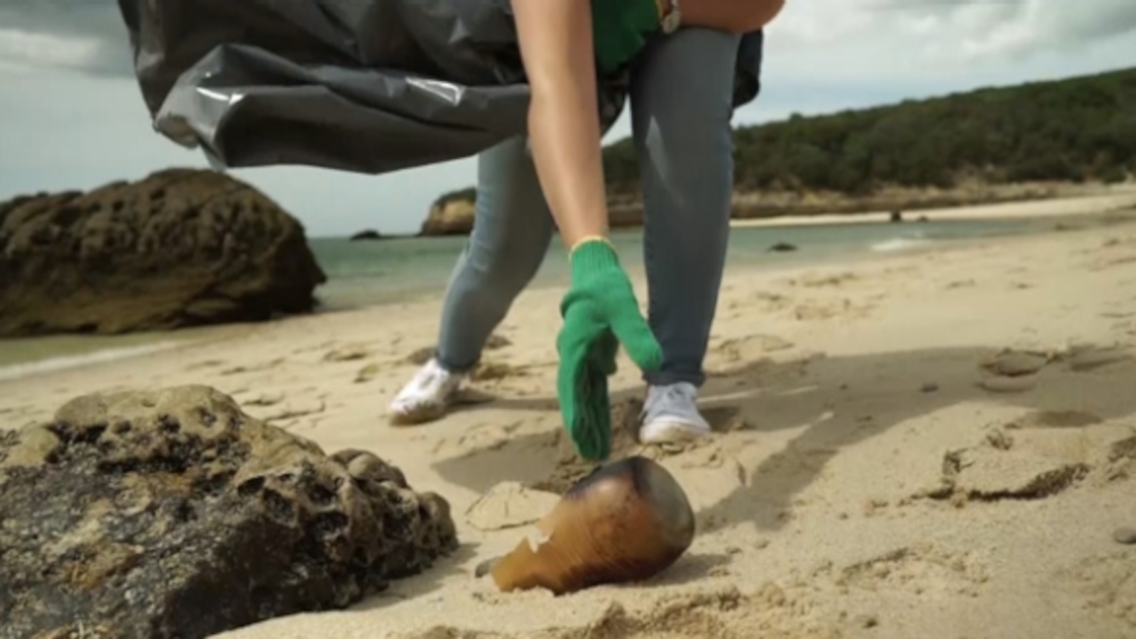 collecting trash at a beach