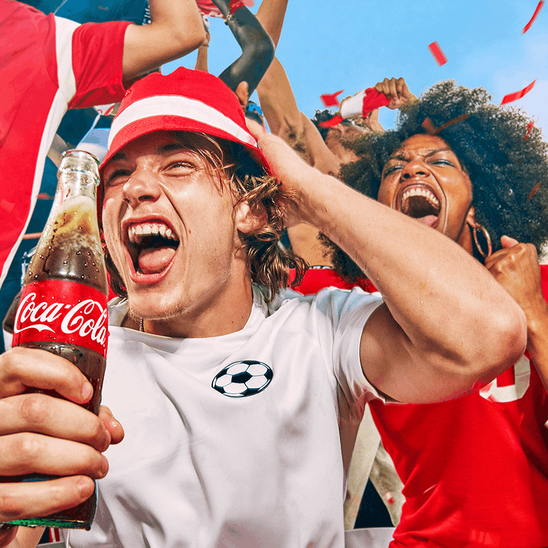 Fans celebrating Football world cup with Coca-Cola