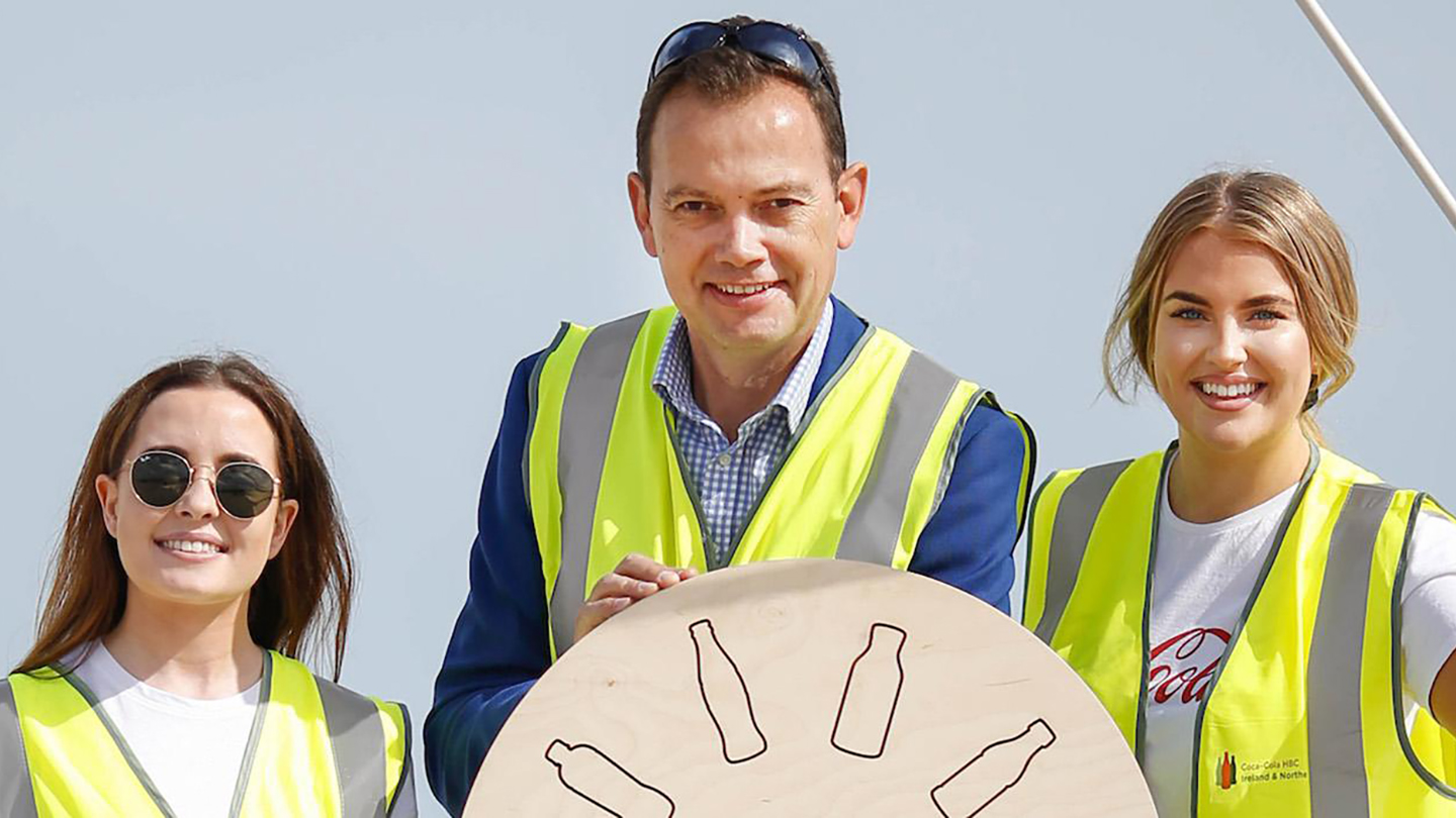 Group of people wearing safety vest smilling