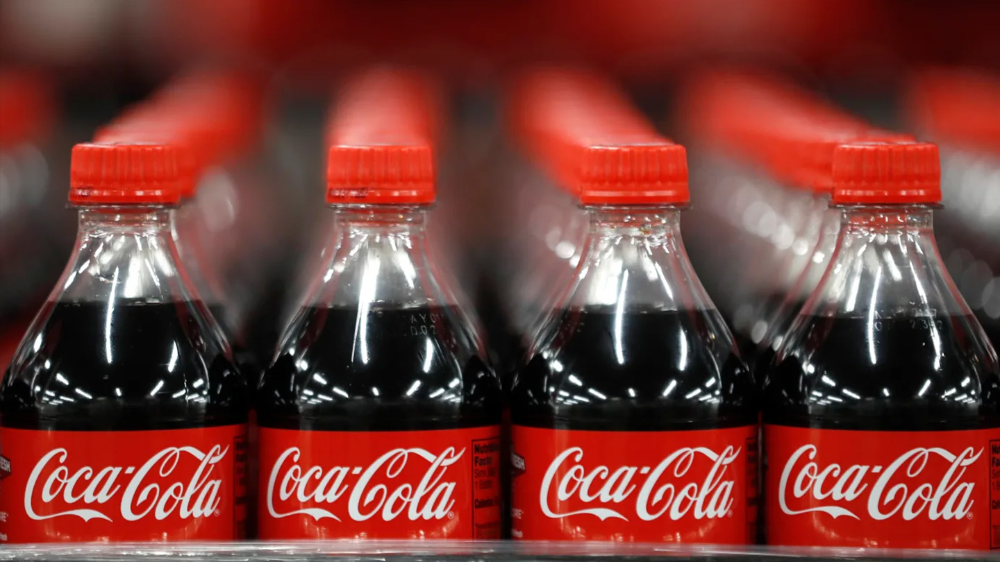 Detail of multiple bottles of Coca-Cola lined up