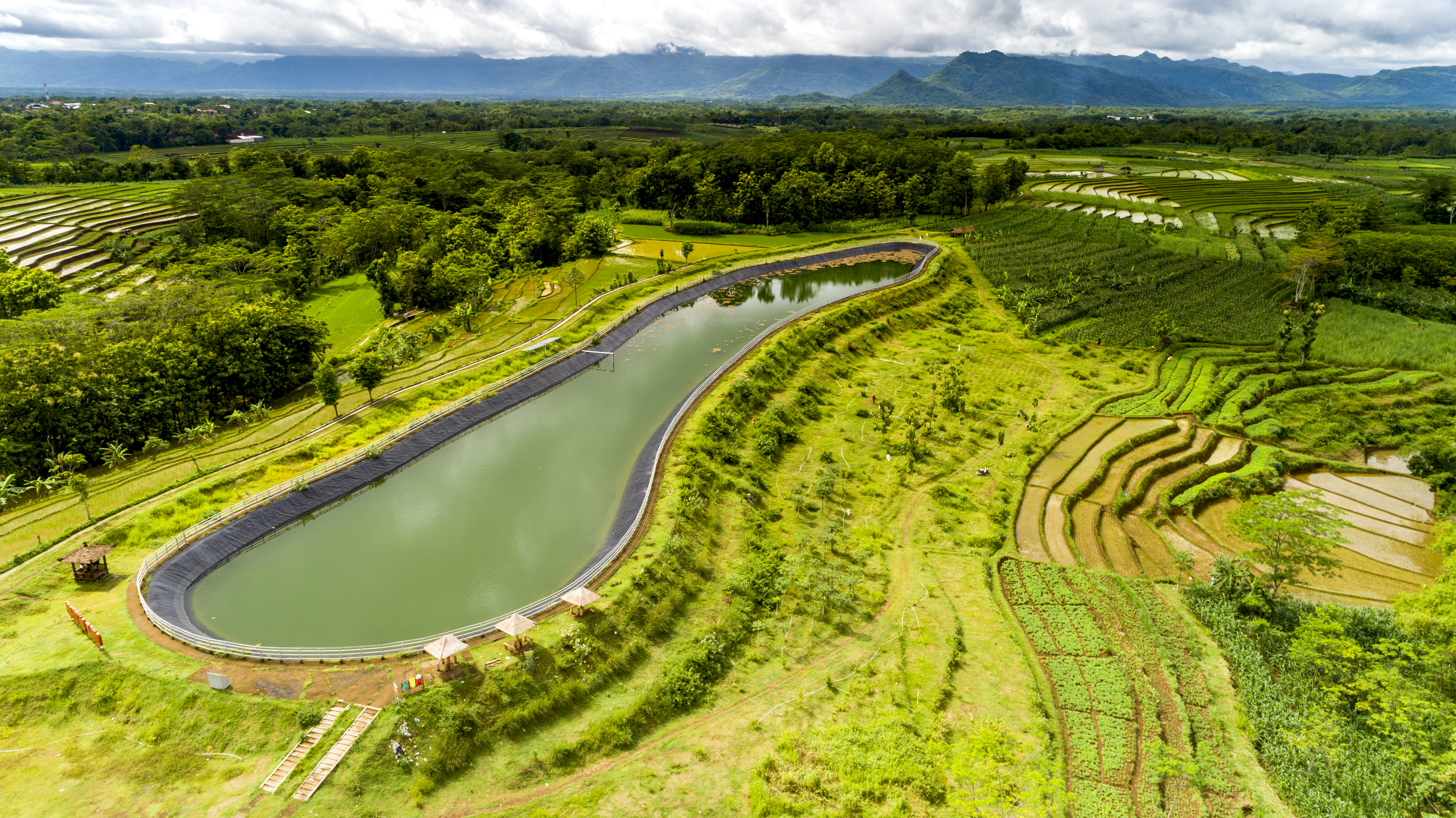 Aerial view of a dam in a rural area