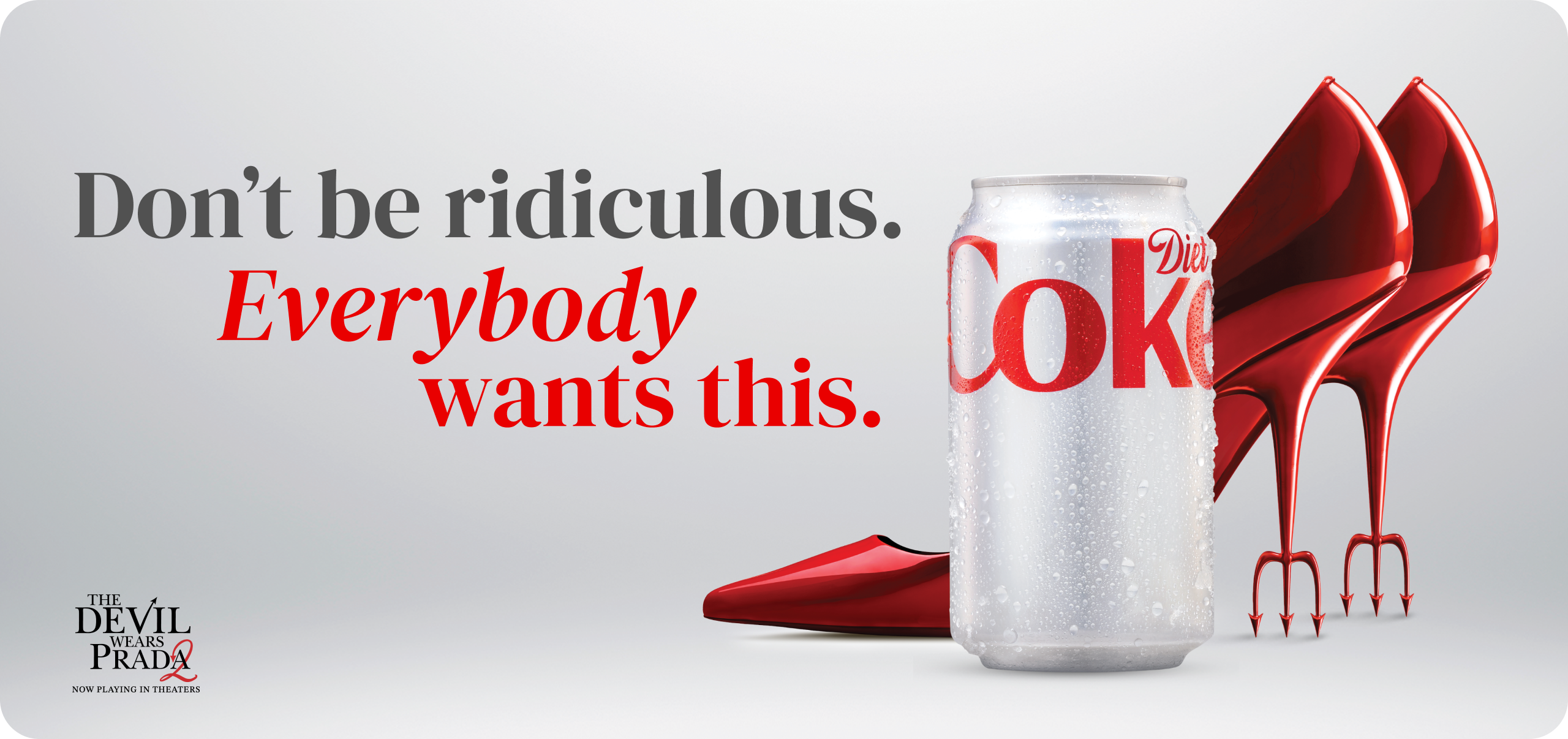 Diet Coke can with red stiletto heels and tagline ‘Don’t be ridiculous. Everybody wants this.’ in movie tie-in promo banner.