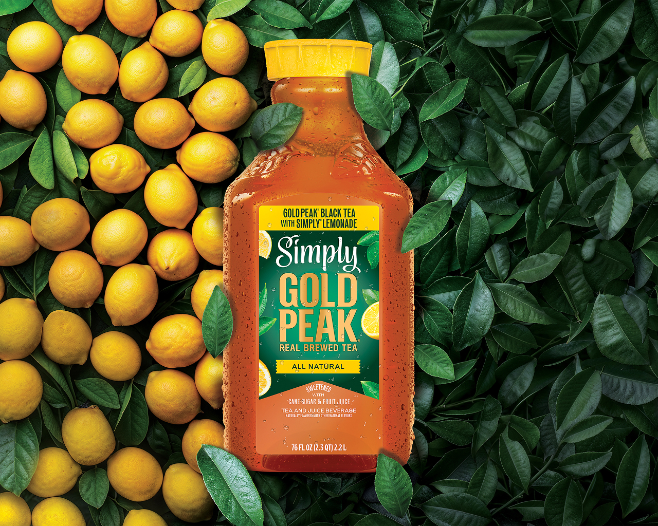 Three bottles of Simply Gold Peak beverages with a filled, chilled glass