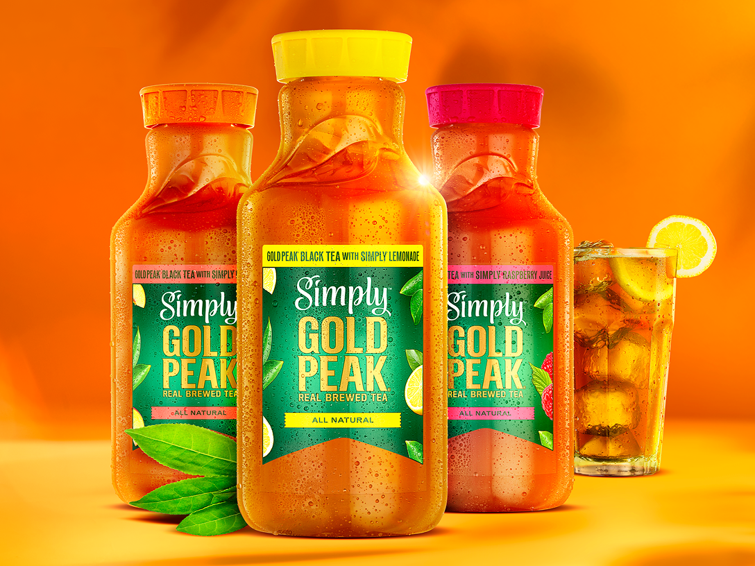 Three bottles of Simply Gold Peak beverages with a filled, chilled glass