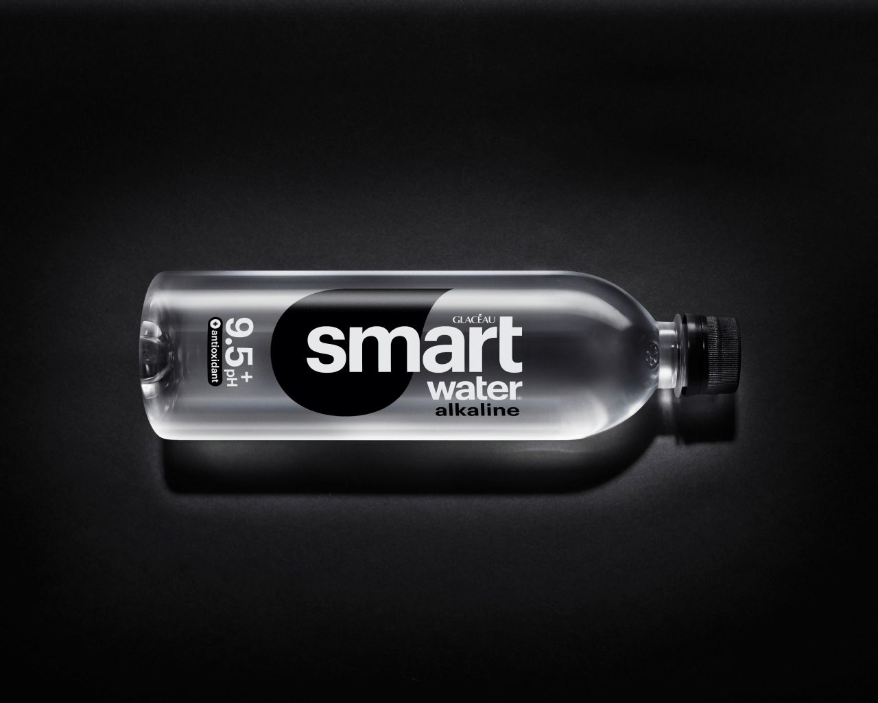 smartwater alkaline bottle on a black background