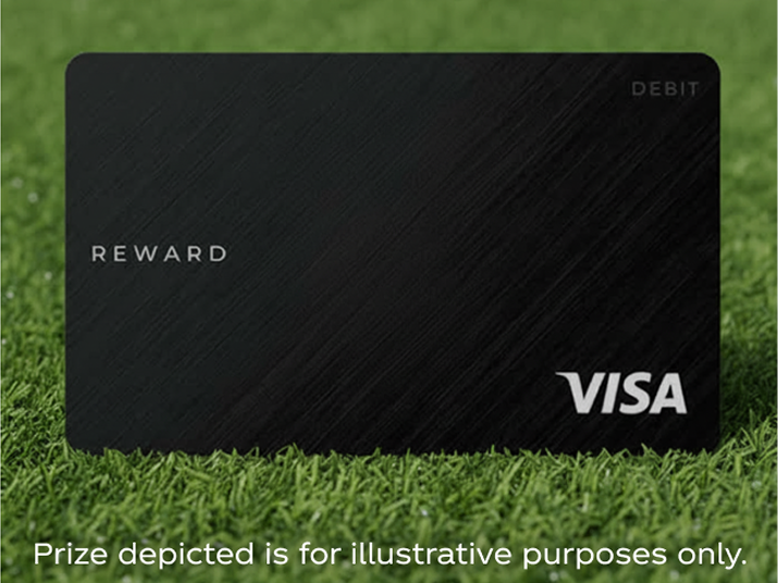 Black Visa reward debit card lying on grass representing prepaid card prize for Coca-Cola Matchday promotion.