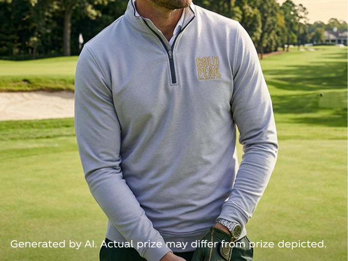 Man in a light gray Gold Peak golf pullover stands on a sunny fairway, adjusting his glove for a PGA sweepstakes promo.