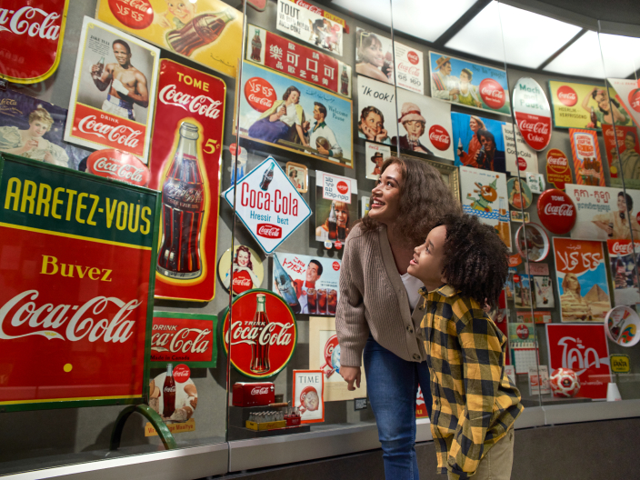 people viewing images at world of coca-cola