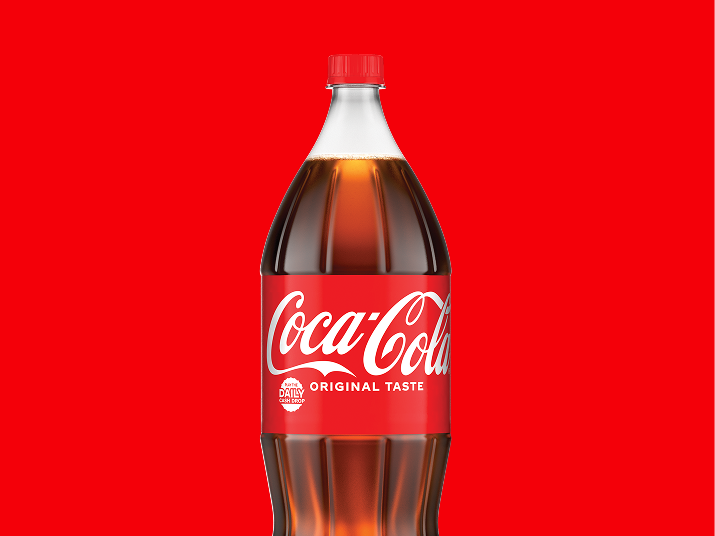 Coca-Cola 2-liter bottle on a bold red background, representing Step 1 of the promotion: Buy any participating 2-liter Coca-Cola product to enter the Daily Cash Drop giveaway.