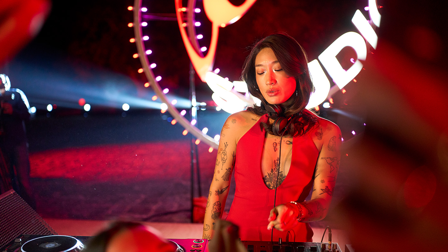 Peggy Gou on stage mixing tracks