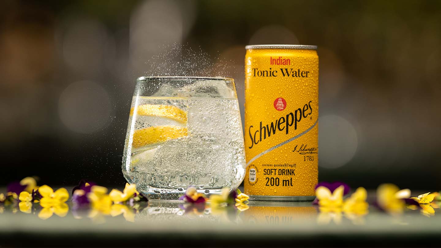 Glass of Schweppes drink